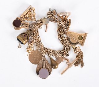 A Vintage Charm Bracelet, Gold Filled and Gold