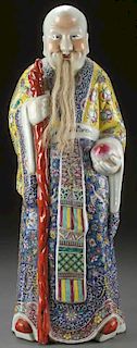A LARGE CHINESE ENAMELED PORCELAIN IMMORTAL