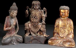 A GROUP OF THREE CARVED POLYCHROME AND GILT WOOD