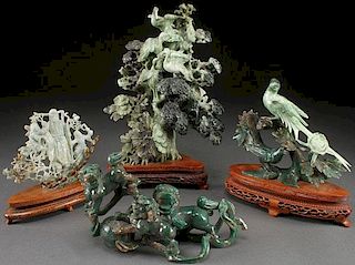 FOUR CHINESE CARVED JADEITE FIGURAL GROUPS