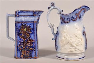 Two Various Flow Blue China Pitchers.