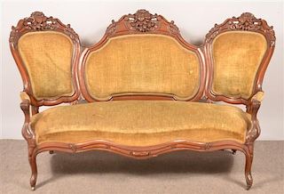 Victorian Carved and Molded Walnut Settee.