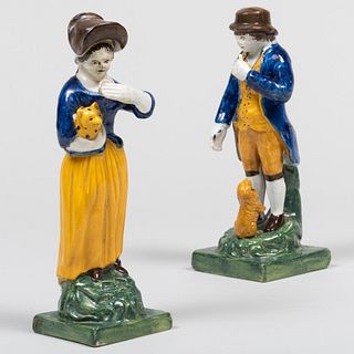 Pair of Staffordshire Pearlware Figures of a Man and Woman with a Cat and Dog