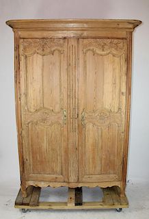 French Provincial natural finish carved armoire