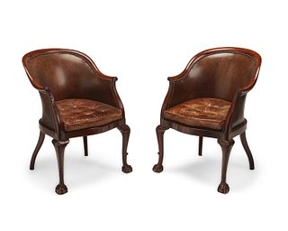 A pair of Chippendale-style bucket chairs