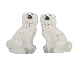 A pair of gilt ceramic Staffordshire-style dogs