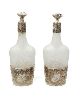 A pair of Daum glass and sterling silver perfume bottles
