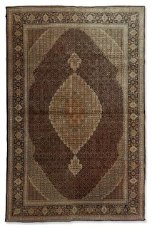A Persian Tabriz rug