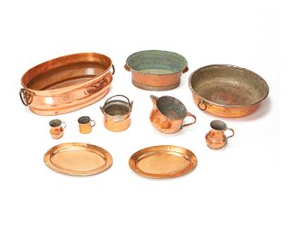 A group of copper table items