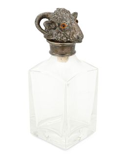 A glass and silver-plate ram's head decanter