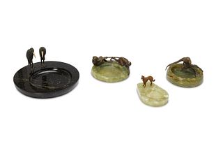 A group of Austrian bronze and stone ashtrays