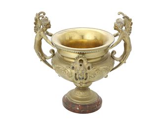 A French Empire-style bronze urn