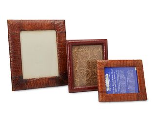 A group of three hide-wrapped frames