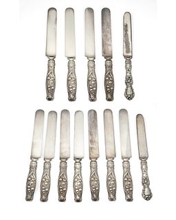 A group of sterling silver knives