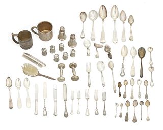 A group of silver flatware and objects