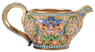 A RUSSIAN SILVER GILT AND SHADED ENAMEL CREAMER