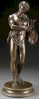 A LCLASSICAL PATINATED BRONZE FIGURE OF APOLLO