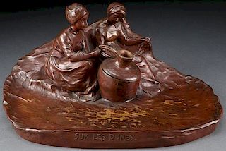 A PATINATED BRONZE FIGURAL INKWELL