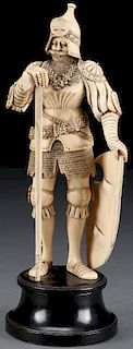 A FINELY CARVED IVORY FIGURE OF A STANDING KNIGHT