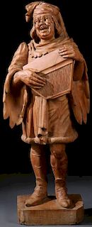 A CARVED WOOD FIGURE OF A STREET MUSICIAN