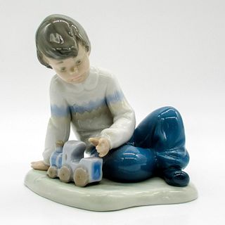 NAO by Lladro Porcelain Figurine, Boy with Train