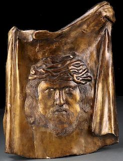 A CARVED AND GILT WOOD PLAQUE OF THE VEIL