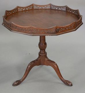 Mahogany tip table with gallery top. ht. 28in., dia. 30in.