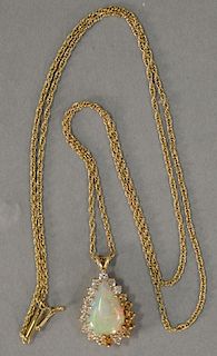 14K gold chain and pendant with teardrop opal surrounded by diamonds. total weight 7.3 grams