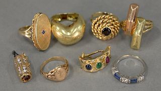 Six piece gold lot including 14K two rings, one earring, three unmarked rings, and one 10K and diamond clasp, plus a silver r