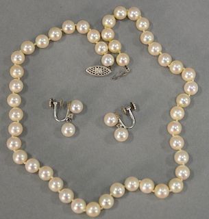 Three piece lot including pair of Cartier white gold earrings set with small diamond and two pearls each and a single string