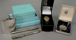 Five piece silver lot including two Tiffany silver pens marked Peretti in original bags and boxes, a small silver flask, a si