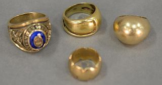 Four rings including one 18K, three 14K including one dome ring. 42.2 grams.