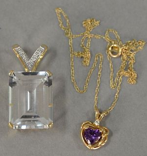 Two piece lot including heart shaped pendant with amethyst and large 14K emerald cut topaz pendant.