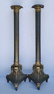 Pair of tall candle holders in bronxe Signed A.K.