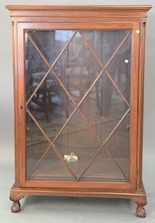 Mahogany one door bookcase with ball and claw feet. ht. 56in., lg. 37in., dp. 16in.