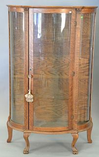 Victorian oak bow glass china cabinet. ht. 62in., wd. 38 1/2in., dp. 15 1/2in.
