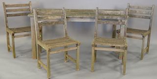 Teak outdoor table and four chairs. table top: 28" x 59"