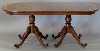Mahogany double pedestal dining table with three 23" leaves. top: 45" x 71", open: 45" x 140"