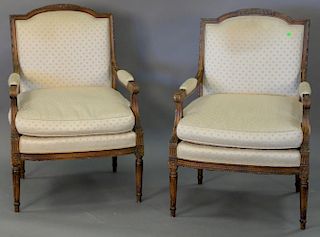 Pair of Louis XVI style armchairs with silk upholstery.