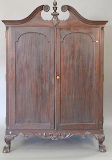 Chippendale style mahogany cabinet with two doors opening to reveal fitted drawers and doors, on ball and claw feet, early 20