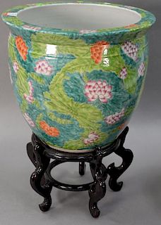 Large Famille Rose porcelain planter fish bowl with painted leaves and flowers on stand. ht. 14 1/2in., dia. 16in.