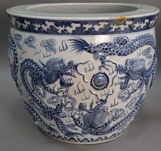 Large blue and white porcelain molded dragon planter/fish bowl having molded four claw dragons. ht. 14in., dia. 16in.