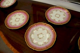 Set of twelve French Limoges plates with heavy gold border sold by Higgins and Seiter New York, dia. 9 1/2in.