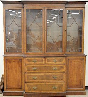 Continental mahogany breakfront, banded inlaid with four glass doors over center row of drawers flanked by doors. ht. 89in.,