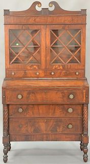 Sheraton mahogany secretary desk in two parts, upper section with two doors over two drawers on lower section with hinged rec