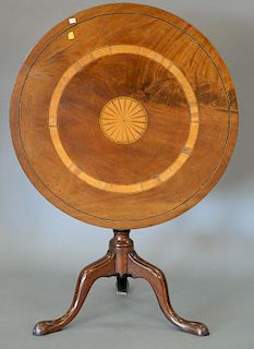 Mahogany tip table with inlaid top on tripod base, late 18th to early 19th century. ht. 27in., dia. 36in.