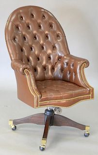 Executive swivel office chair with brown tufted leather. total ht. 46in.