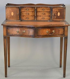 Mahogany desk with leather writing surface. ht. 40in., wd. 36in., dp. 22in.