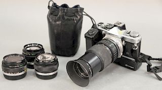 Olympus OM-2 camera with lenses 75-150mm, G. Zuiko 1:1.4 50mm, 1:3.5 28mm, 1:3.5 18mm om-system flash.
