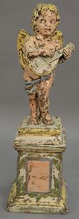 Large ceramic glazed cherub playing a mandolin on pedestal. ht. 46in.